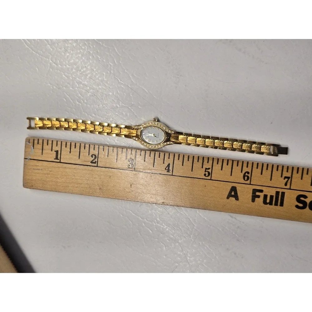 Embassy Womens Watch Gold Tone Rhinestone Bezel Small Chevron Link Bracelet